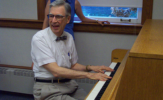Fred Rogers '62 playing the piano at Pittsburgh Seminary